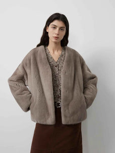 Model wearing Fireladyfur Louvre Sapphire Natural mink V-neck jacket front view