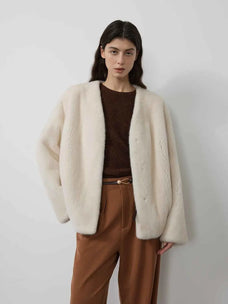 Model wearing Fireladyfur Louvre Pearl Natural mink V-neck jacket casual front view