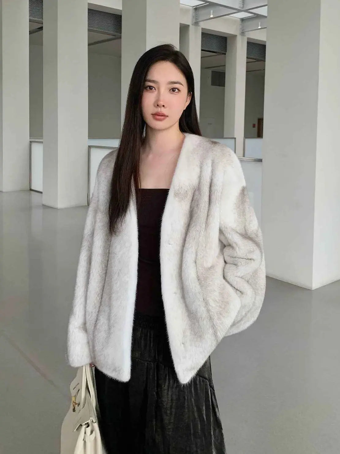 Model wearing Fireladyfur Louvre Silver Blue Cross Natural mink V-neck jacket front view