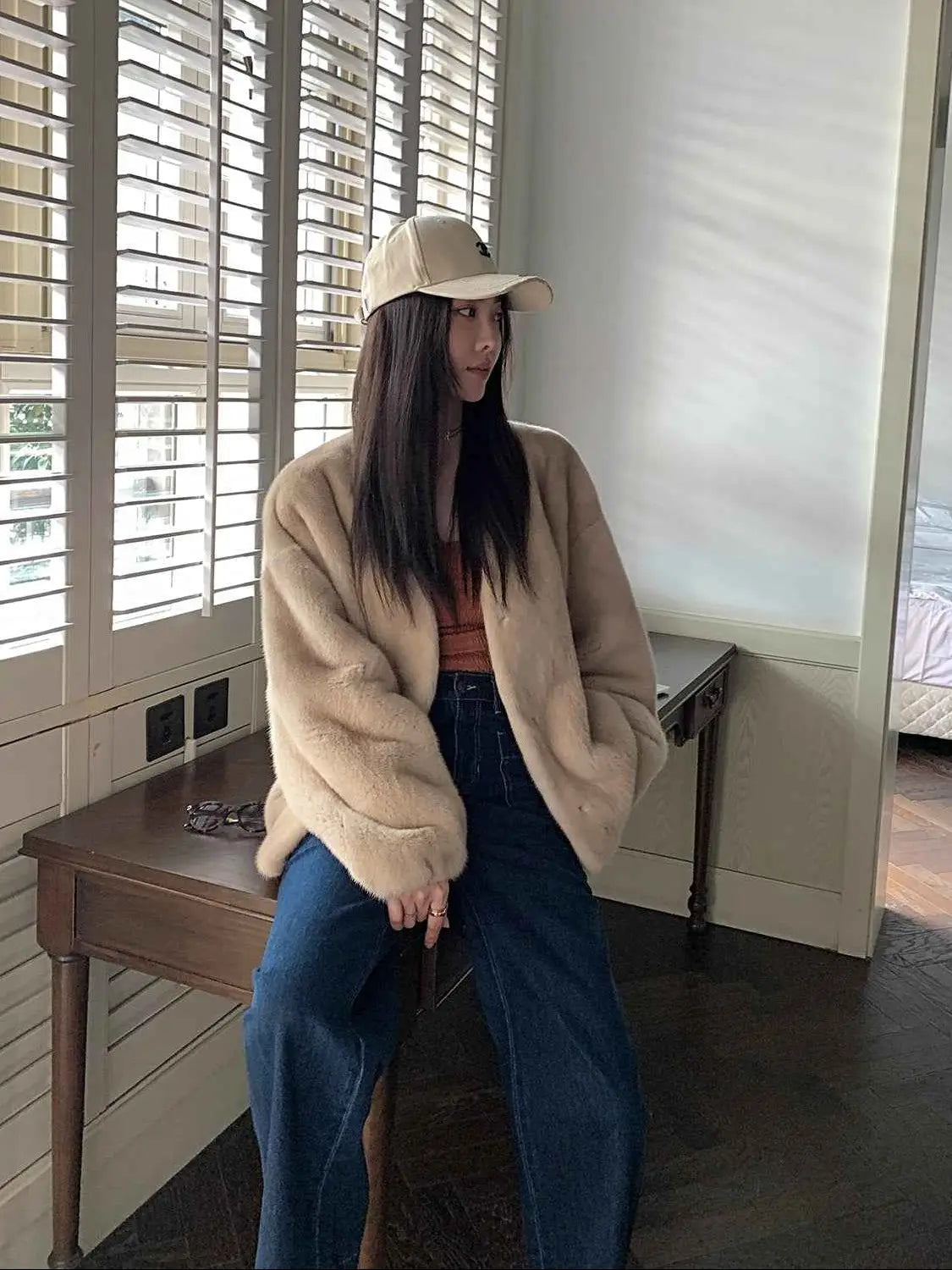 Model wearing Fireladyfur Louvre Beige Natural mink V-neck jacket indoor view