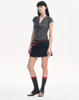 Minimalist Light Gap black sequined Henley T-shirt model side view
