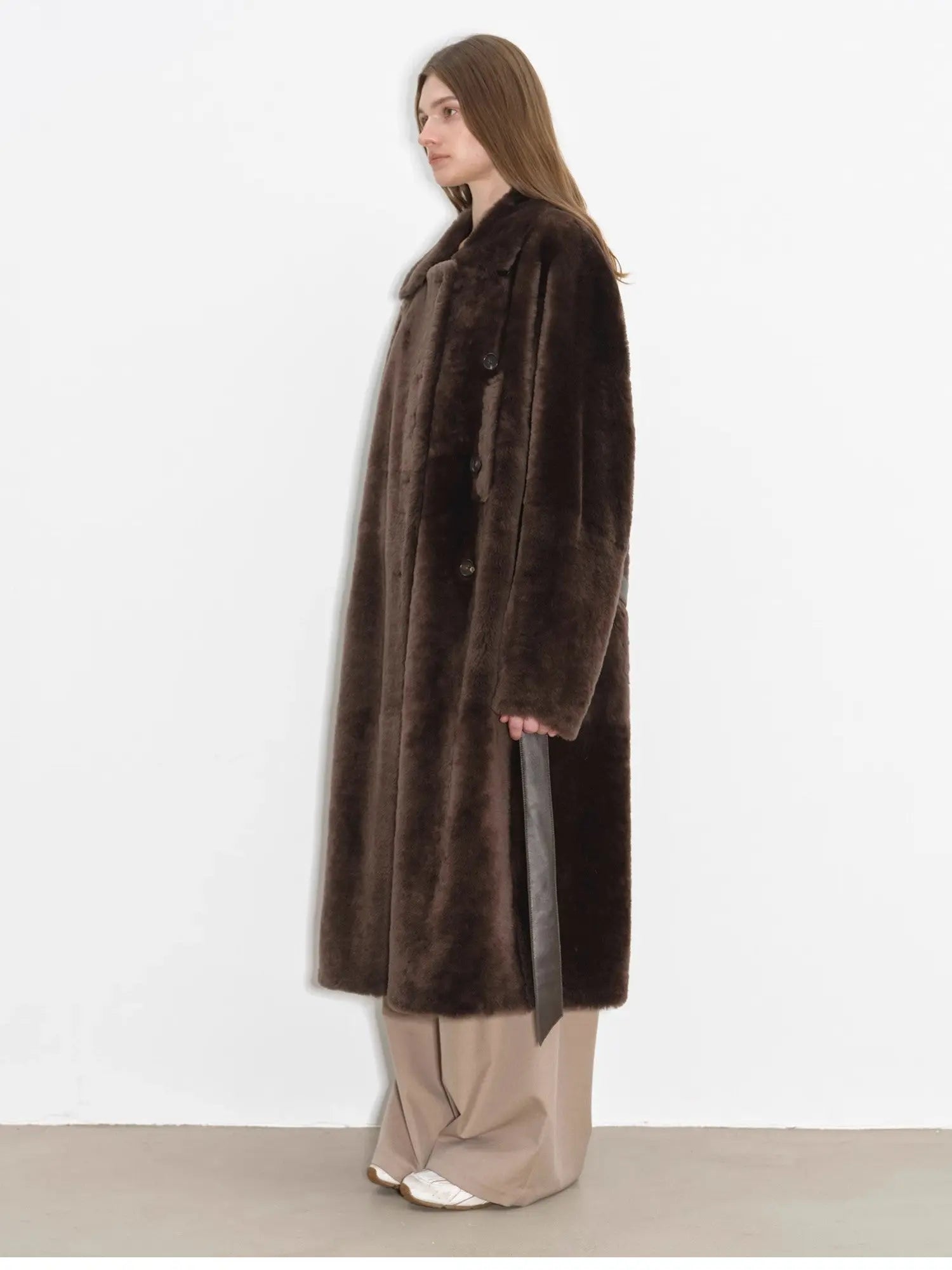Side studio view of Mocha Phantom long shearling coat
