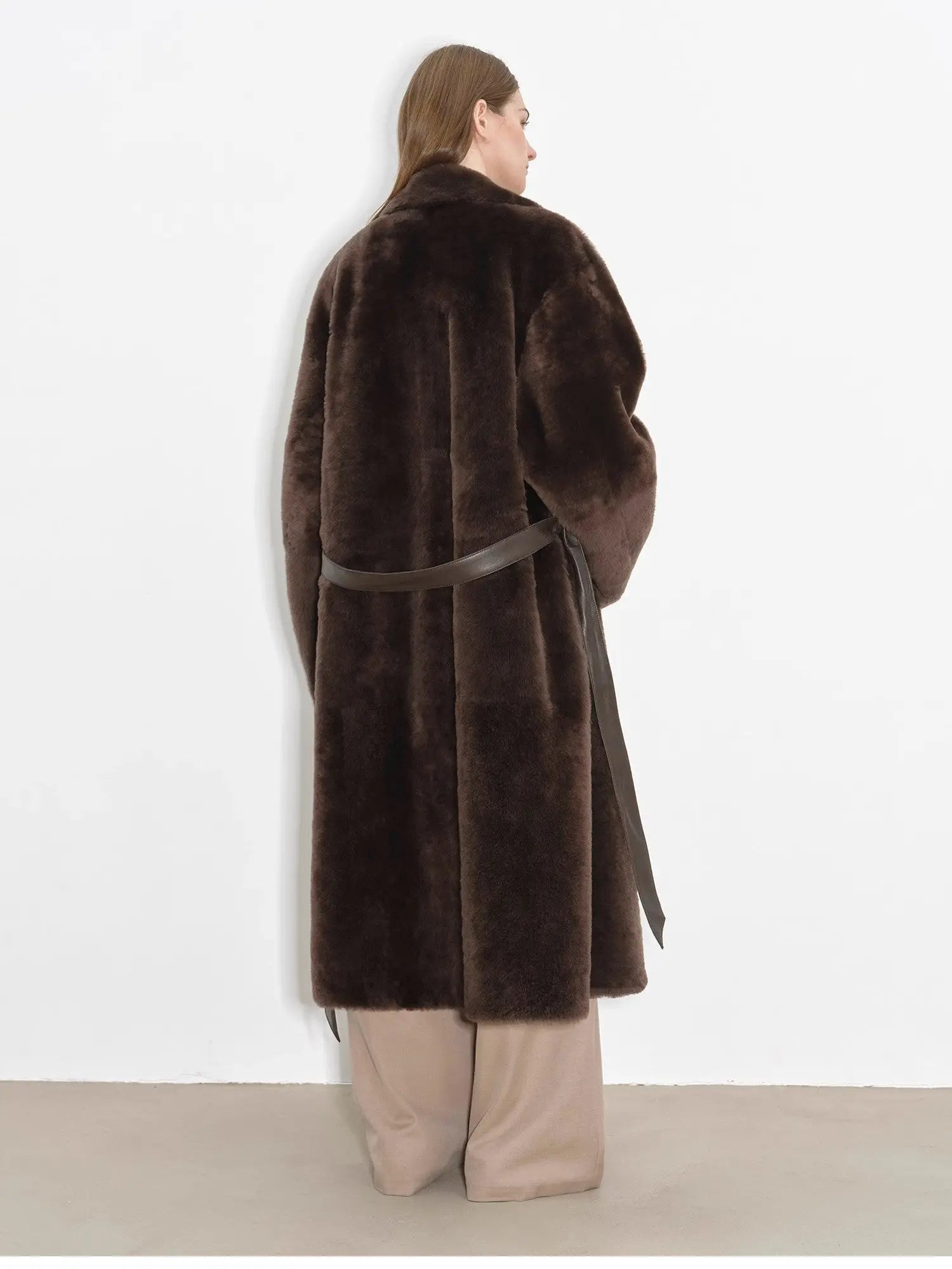 Back studio view of Mocha Phantom belted shearling coat