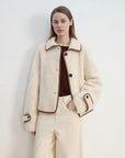 Modern Milk Cafe off-white shearling jacket with contrast trim, close front view