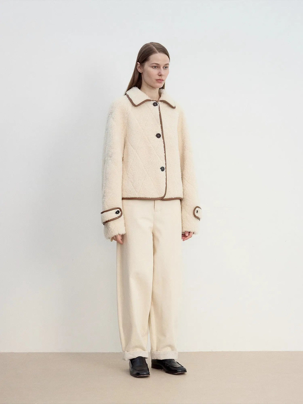 Off-white Merino shearling jacket styled outfit, side angle view