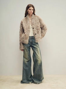 Model wearing the Mole Manor light champagne lake lamb shearling coat, full-length view