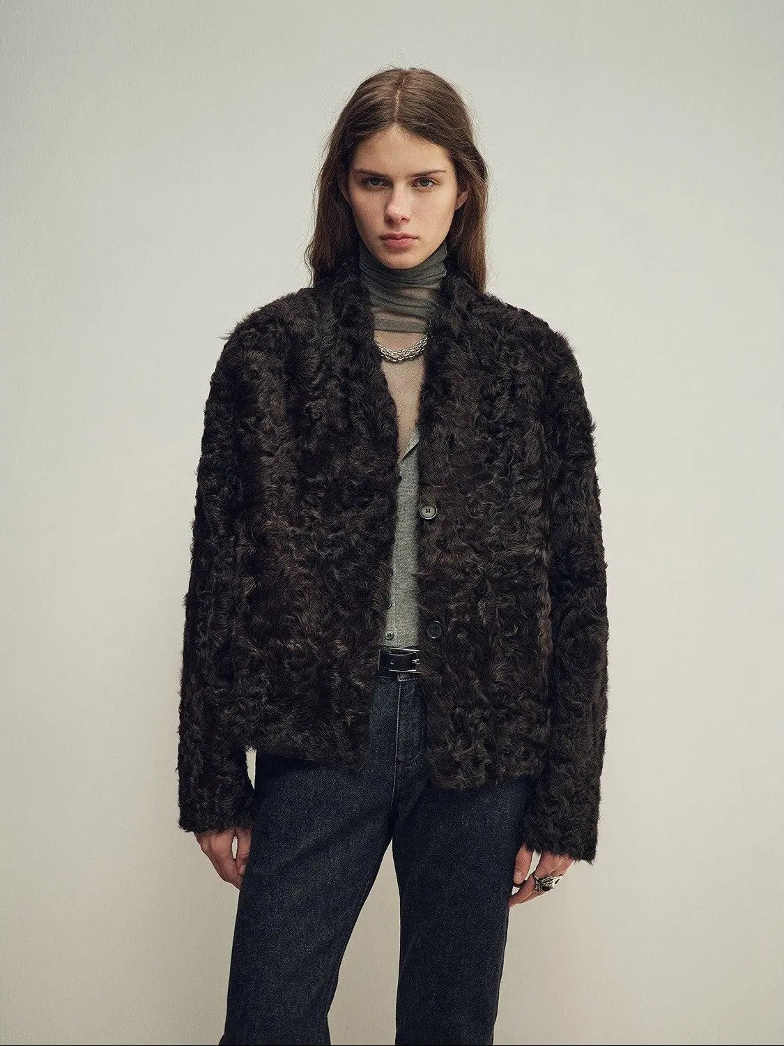 Model wearing the Mole Manor purple plum lake lamb shearling coat, close front view