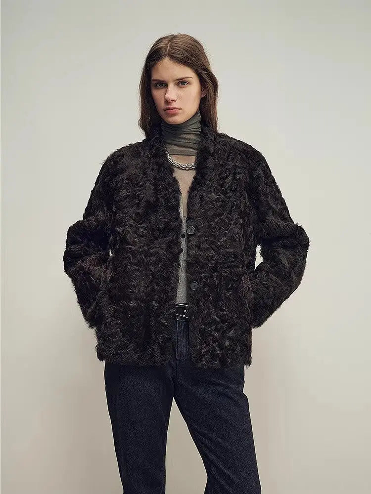 Model wearing the Mole Manor purple plum lake lamb shearling coat, mid-length view