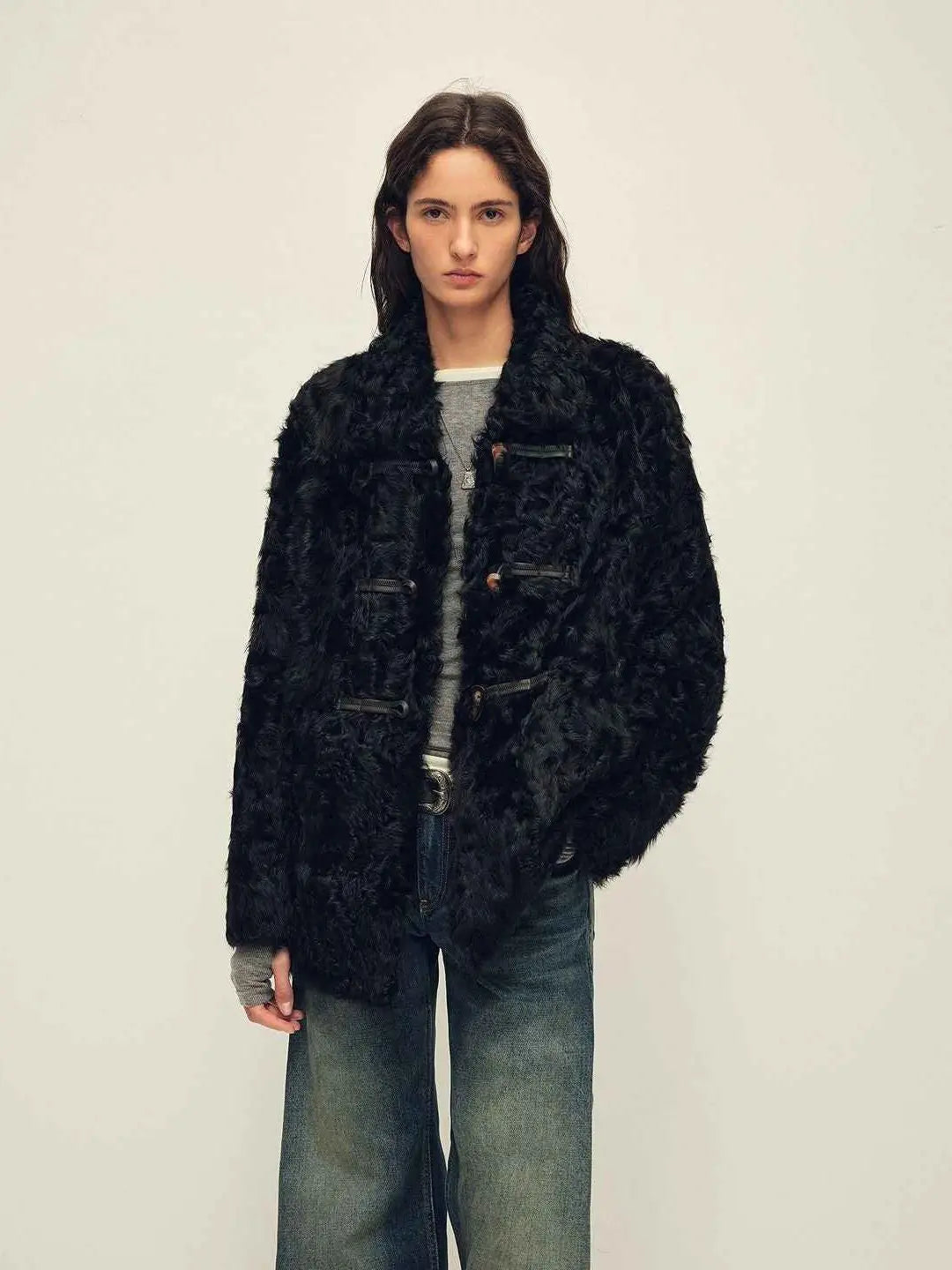 Woman wearing the Moro Garden black water ripple sheepskin coat, front view