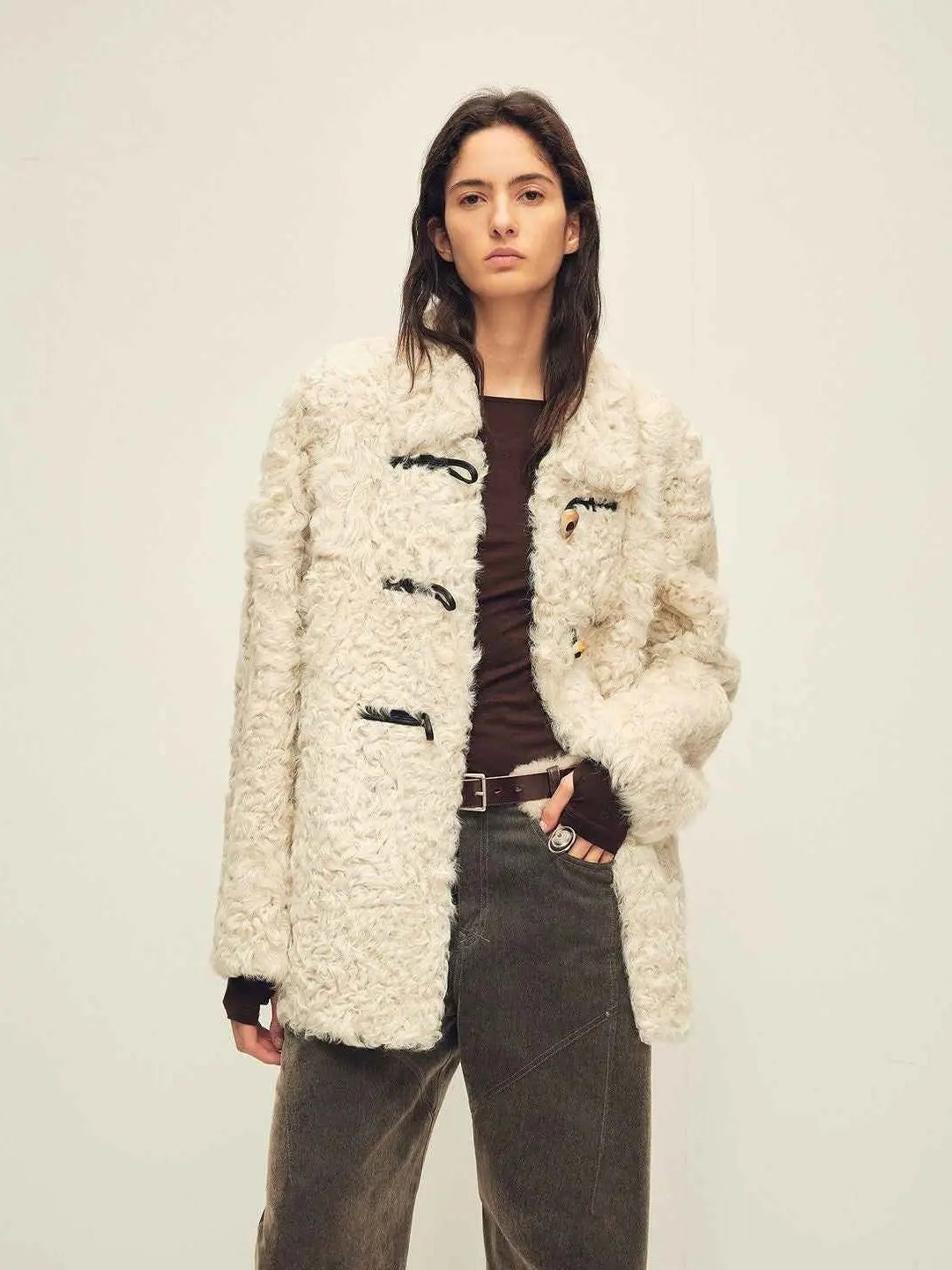 Woman wearing the Moro Garden coconut milk ash sheepskin coat, front view