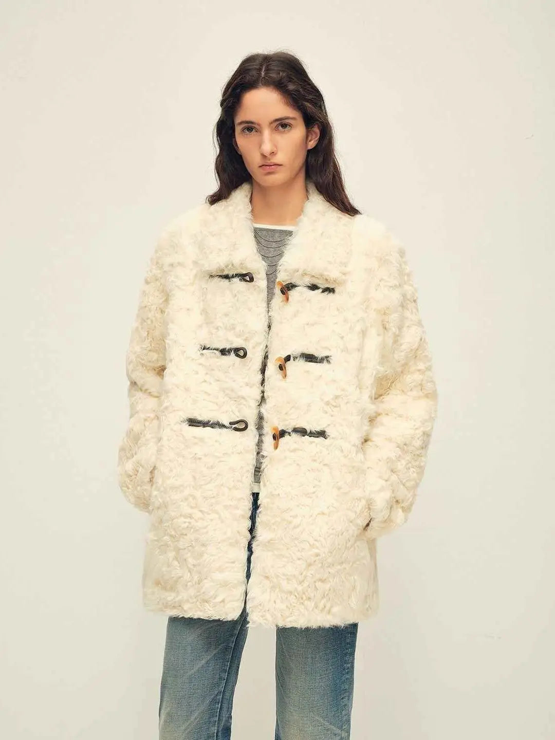 Woman wearing the Moro Garden white water ripple sheepskin coat, front view