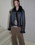 Black Toscana shearling short motorcycle jacket, full-length styling view