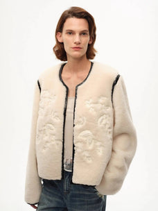 Model wearing the Muse Project embroidered Merino shearling coat, view 1