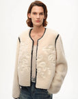 Model wearing the Muse Project embroidered Merino shearling coat, view 1