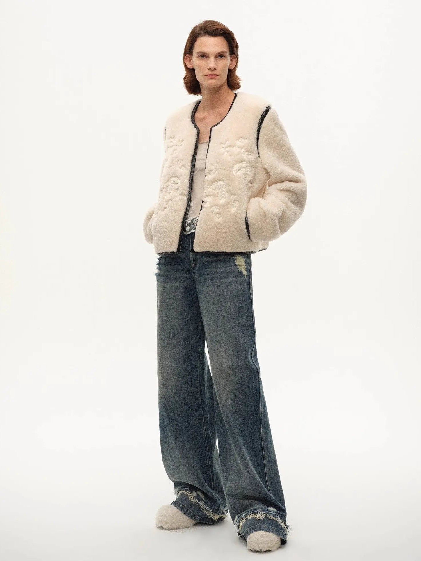 Model wearing the Muse Project embroidered Merino shearling coat, view 7