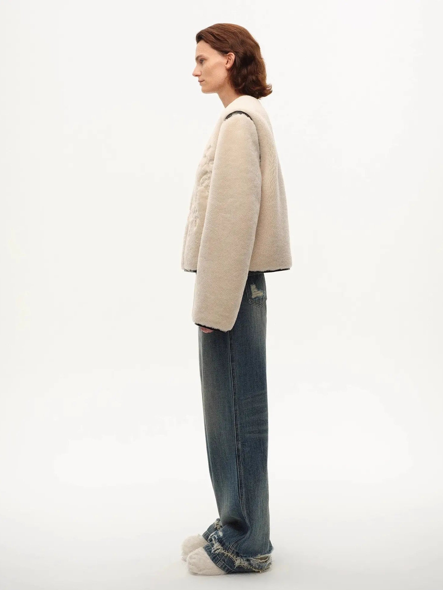 Model wearing the Muse Project embroidered Merino shearling coat, view 9