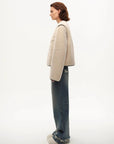 Model wearing the Muse Project embroidered Merino shearling coat, view 9