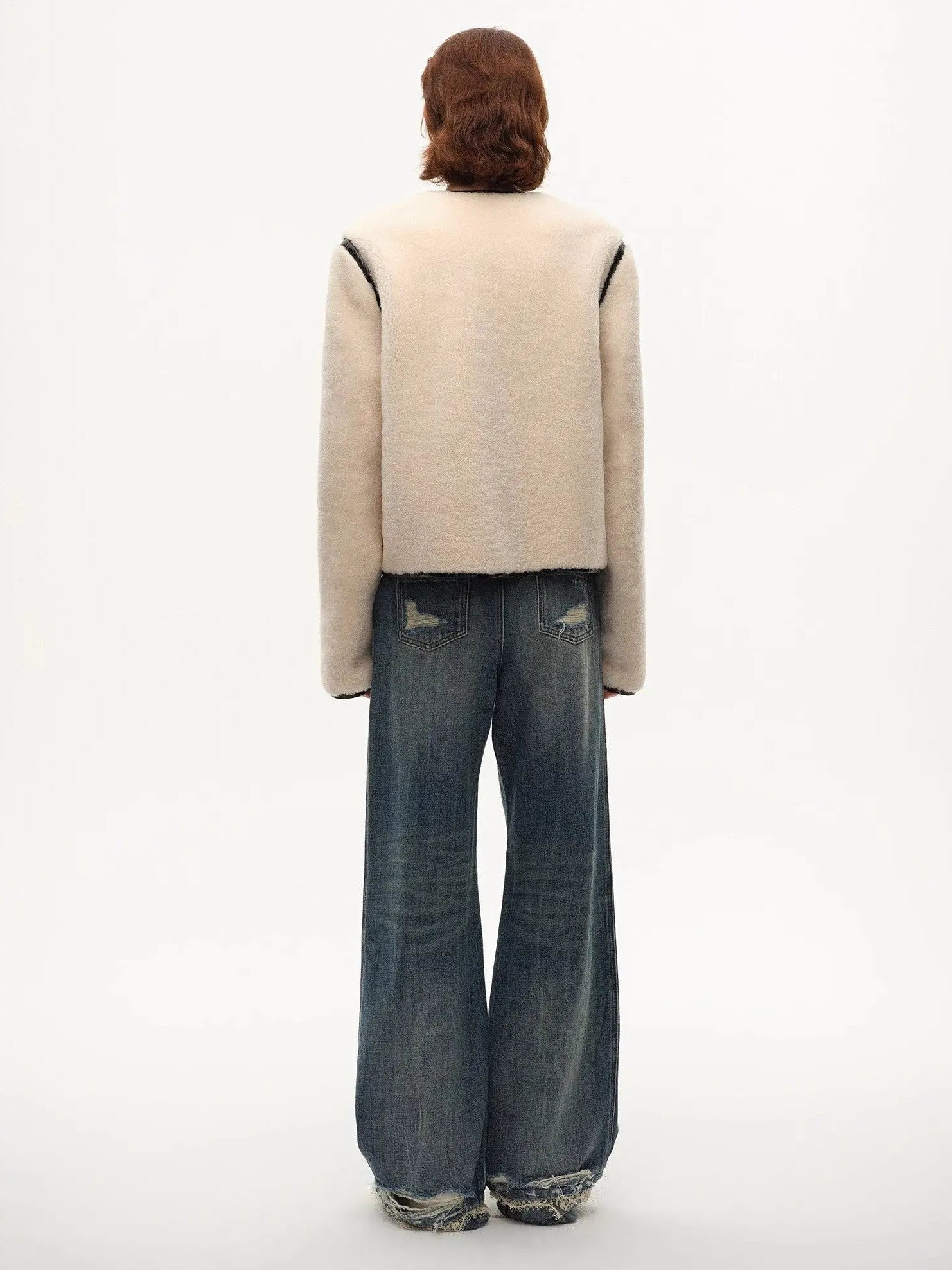 Model wearing the Muse Project embroidered Merino shearling coat, view 10
