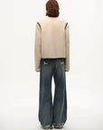 Model wearing the Muse Project embroidered Merino shearling coat, view 10