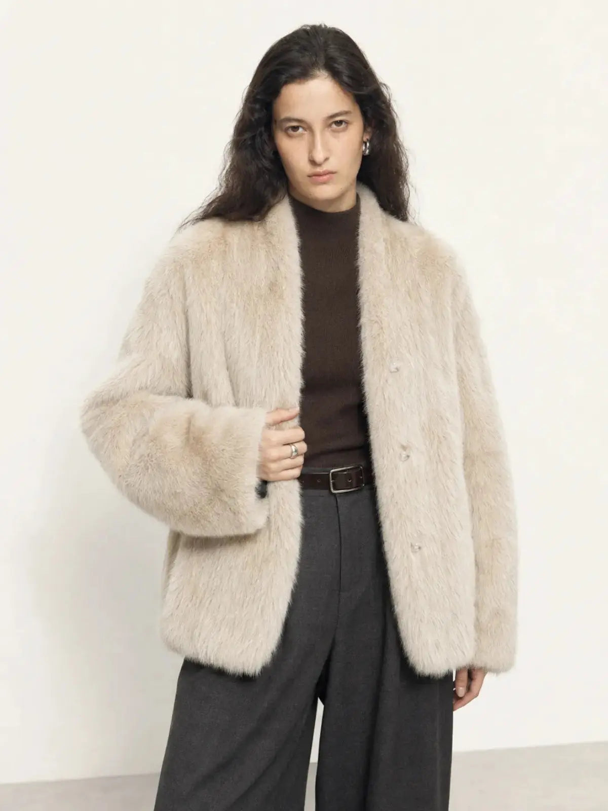 Woman wearing the Night in Paris camel Toscana shearling V-neck coat, front view