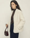 Night in Paris off-white Toscana shearling V-neck coat, three-quarter view