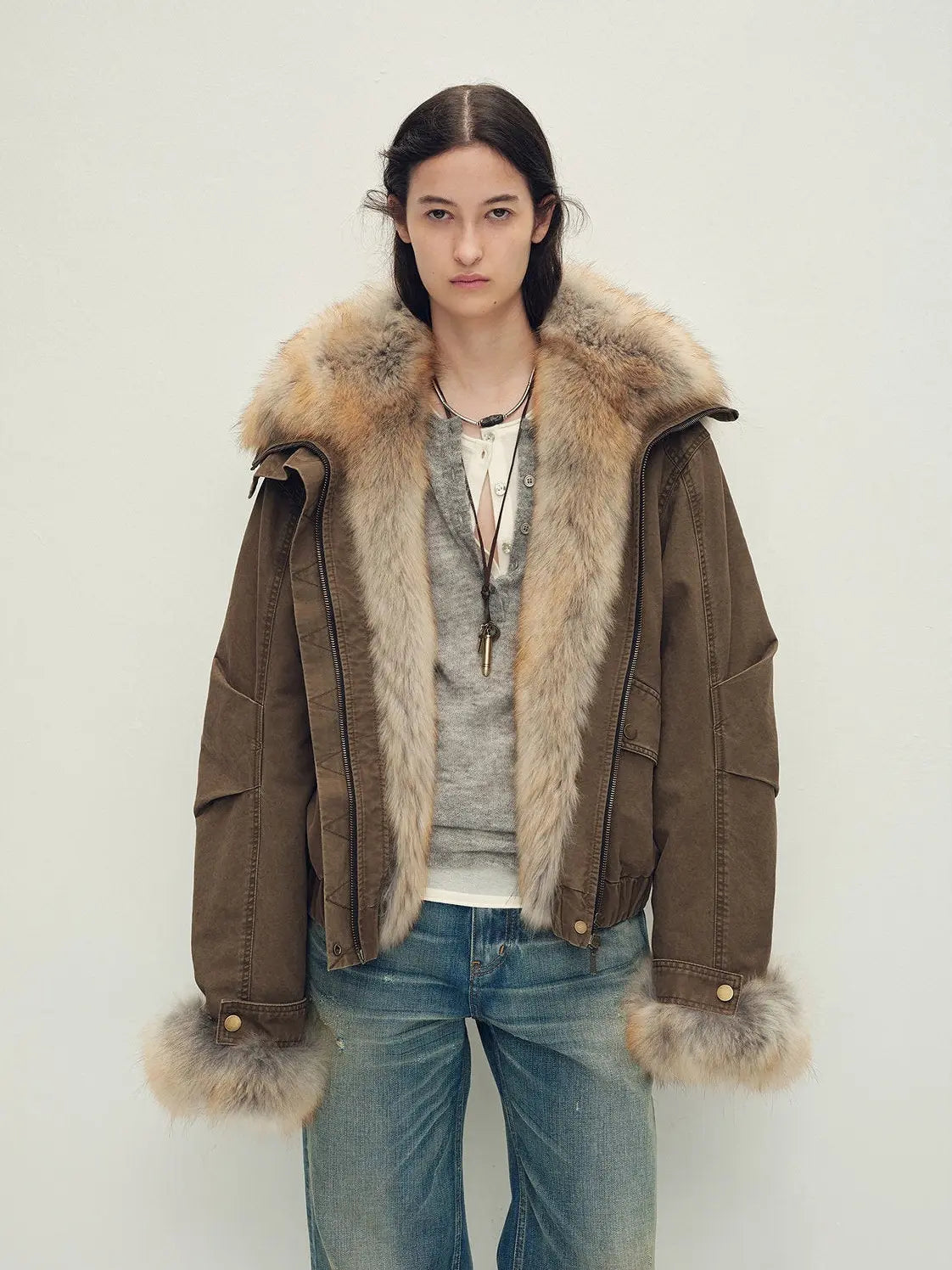 Model wearing Firelady Fur Nordic Woods Dark Brown raccoon fur down parka front view