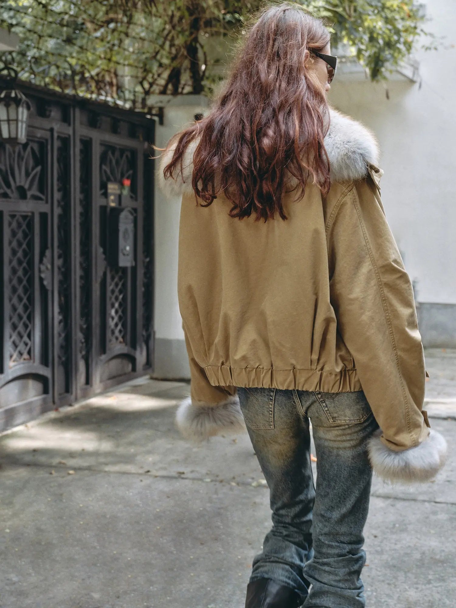 Outdoor back view of Firelady Fur Nordic Woods Khaki cropped raccoon fur parka