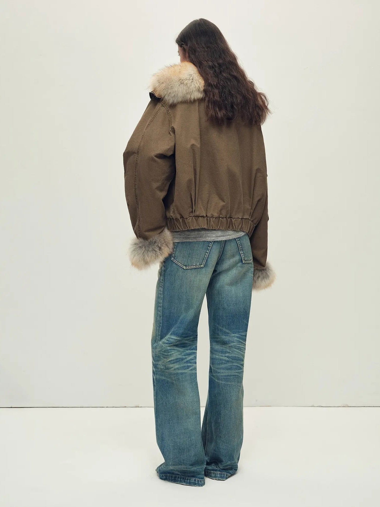 Back model view of Firelady Fur Nordic Woods Khaki cropped raccoon fur parka