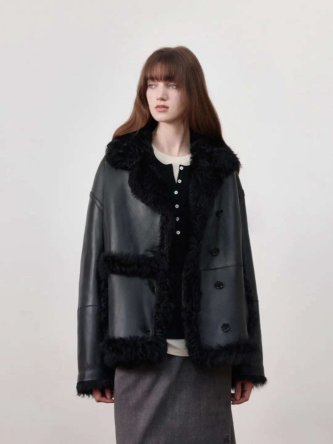 Woman wearing the Oppenheimer black Toscana shearling leather coat