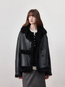 Woman wearing the Oppenheimer black Toscana shearling leather coat