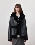 Woman wearing the Oppenheimer black Toscana shearling leather coat