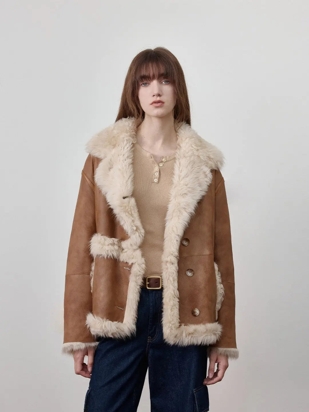 Woman wearing the Oppenheimer brown Toscana shearling leather coat, front view