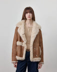 Woman wearing the Oppenheimer brown Toscana shearling leather coat, front view