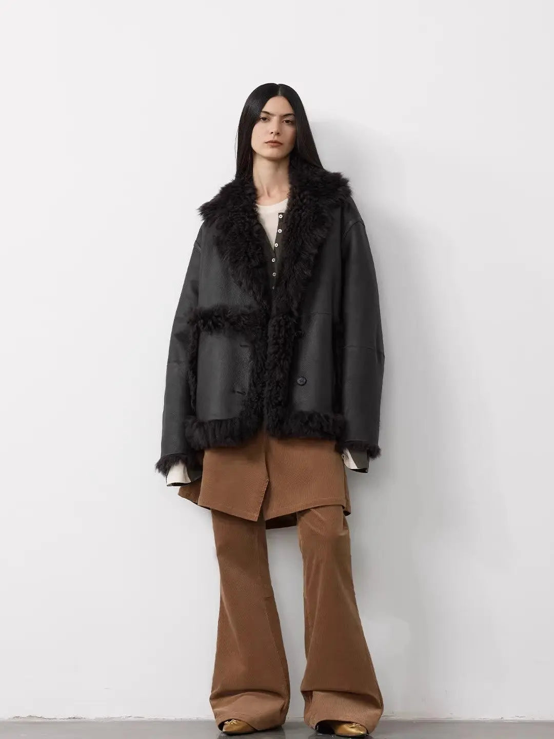 Woman wearing the Oppenheimer yellow brown Toscana coat, full-length view
