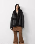Woman wearing the Oppenheimer yellow brown Toscana coat, full-length view