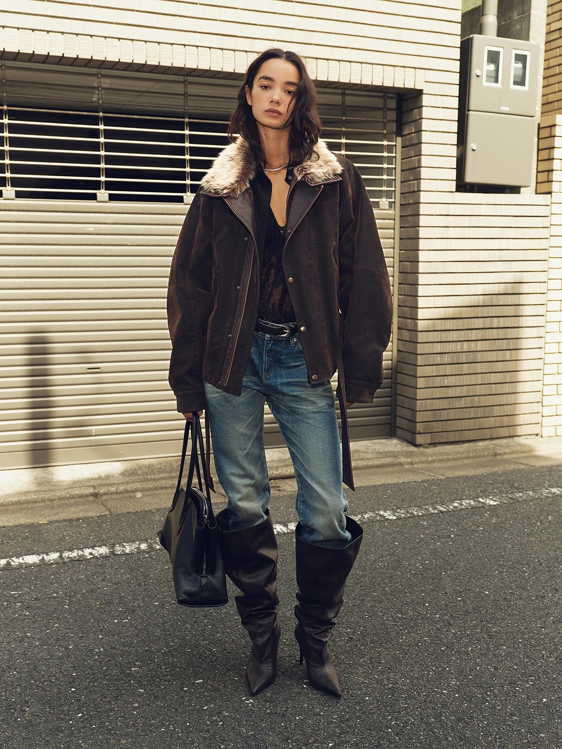 Brown fur-trim parka worn outdoors for the guide route section
