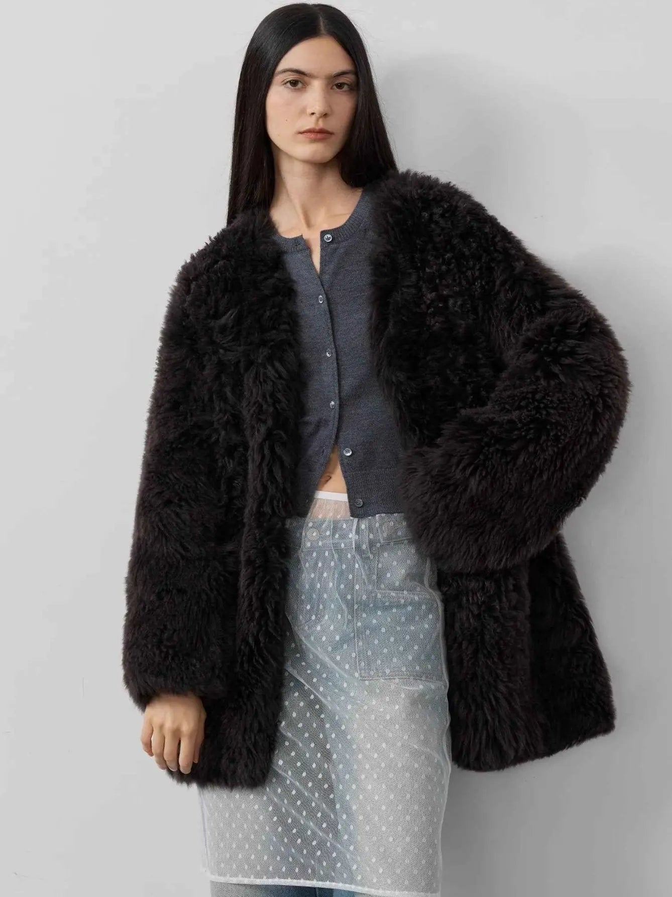 Model styling the Peach Oolong classic black Toscana sheepskin winter coat