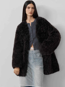 Model styling the Peach Oolong classic black Toscana sheepskin winter coat