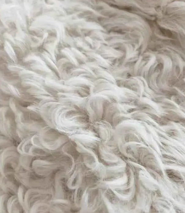 Peach Oolong Toscana shearling coat color and wool texture comparison