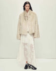 Elegant styling of the Practical Wearism cream white Toscana sheepskin coat