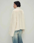 Model wearing the Practical Wearism cream white Toscana sheepskin coat, back view