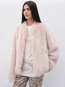 Model wearing the Practical Wearism dirty pink Toscana sheepskin coat, front view