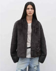 Model wearing the Practical Wearism ink gray Toscana sheepskin coat, front view