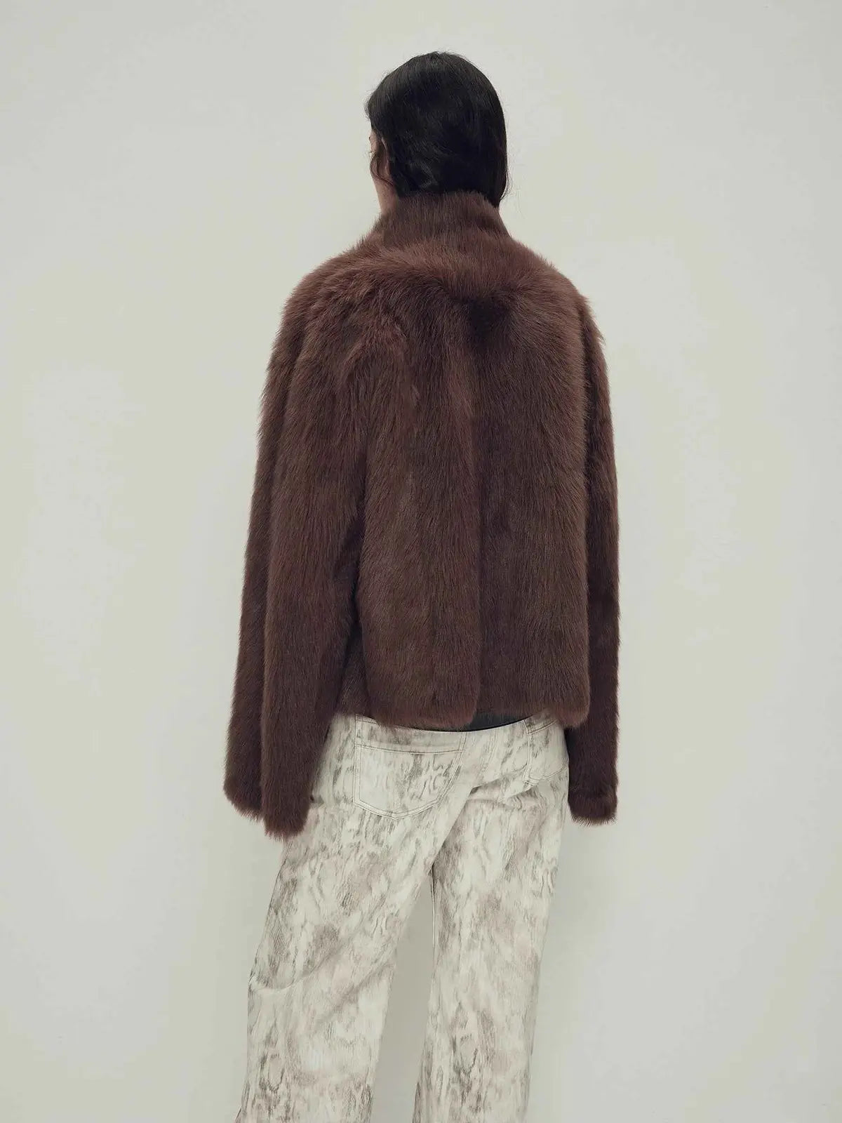 Model wearing the Practical Wearism mocha brown Toscana sheepskin coat, back view