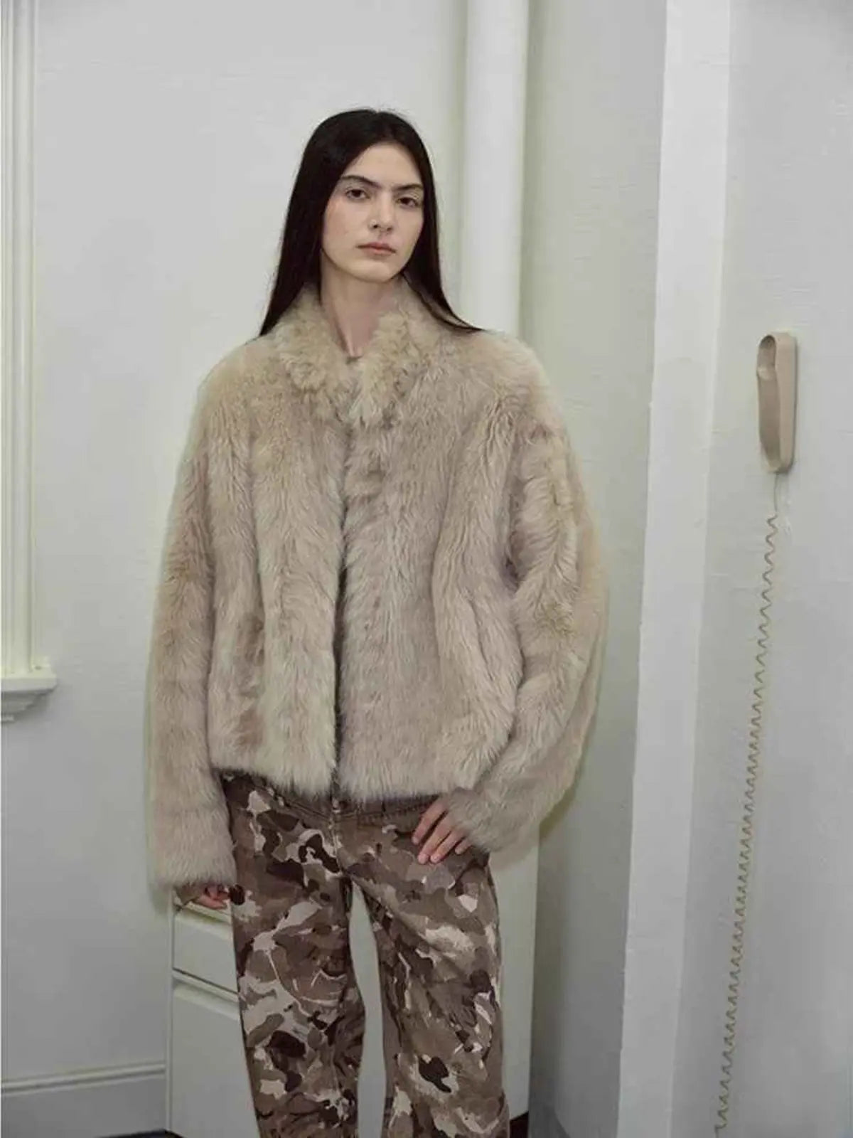 Model styling the Practical Wearism wheat drop-shoulder sheepskin coat