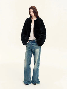 Woman wearing the Quiet Warmth black Merino shearling jacket, full-length view