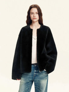Quiet Warmth black Merino shearling jacket styled with denim
