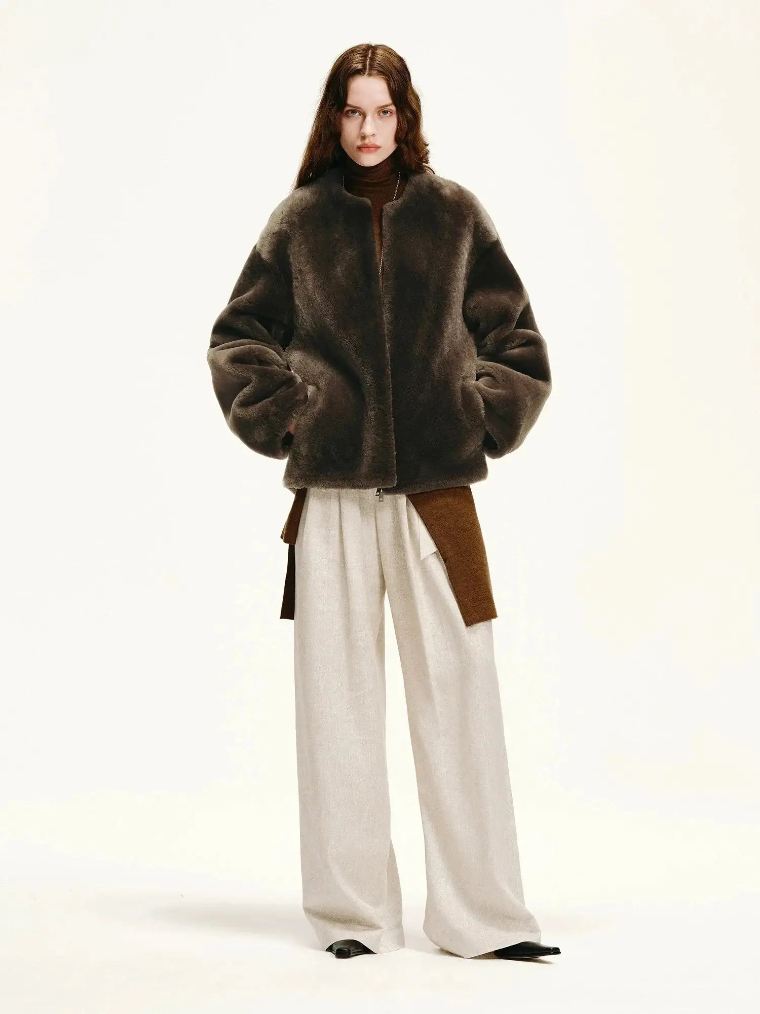Woman styling the Quiet Warmth dark brown Merino shearling jacket
