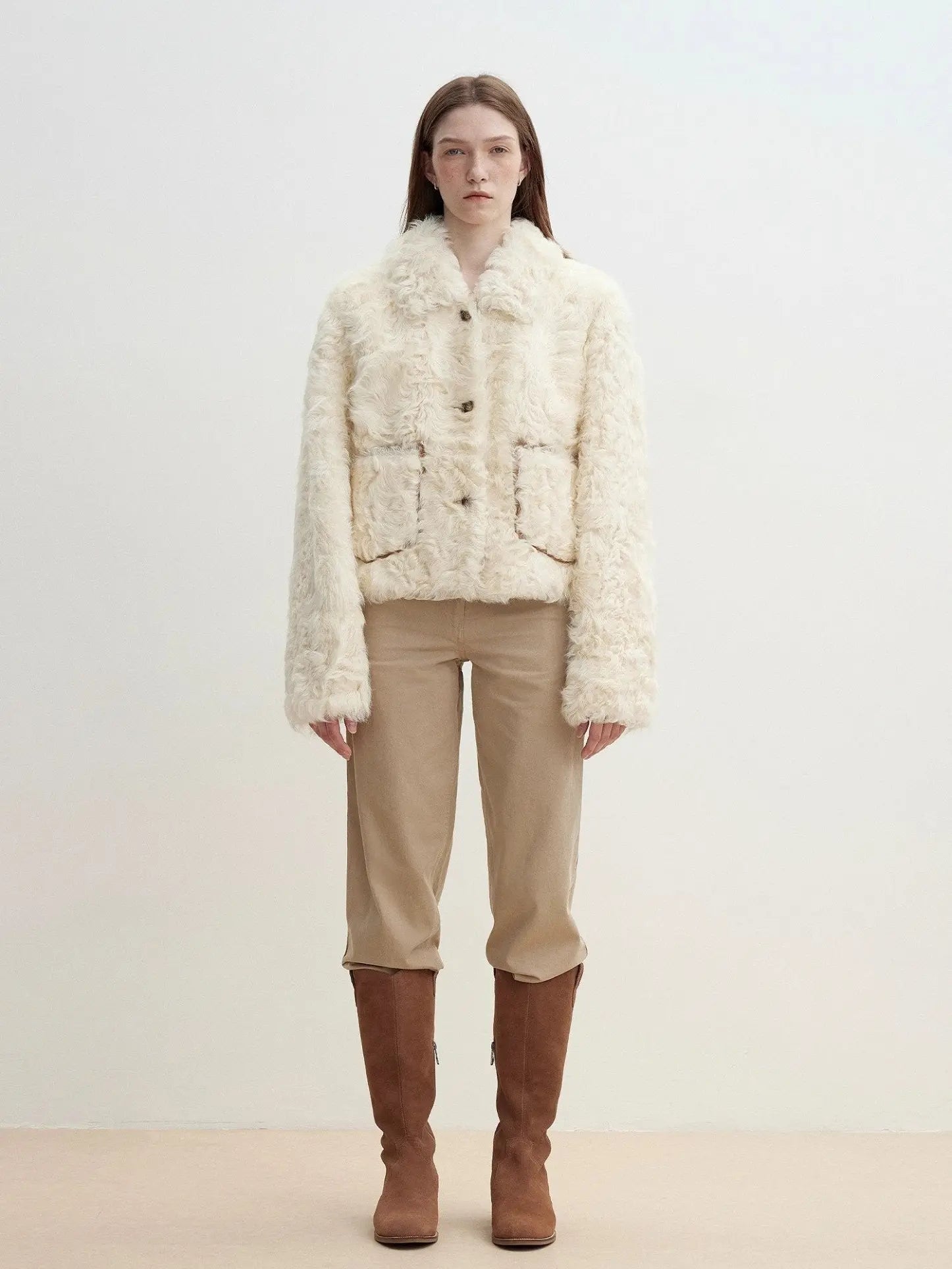 Model wearing the Rachel off-white two-tone curly wool shearling coat, full front view