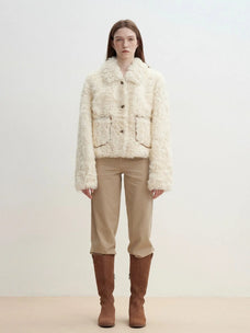 Model wearing the Rachel off-white two-tone curly wool shearling coat, full front view